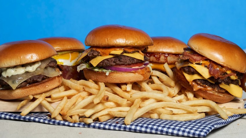Smash burgers with melted cheese and fries